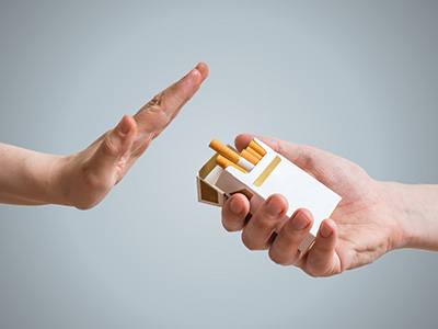Hand refusing the offer of an extended cigarette