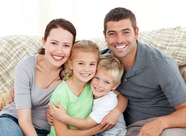 Smiling mother father and two children