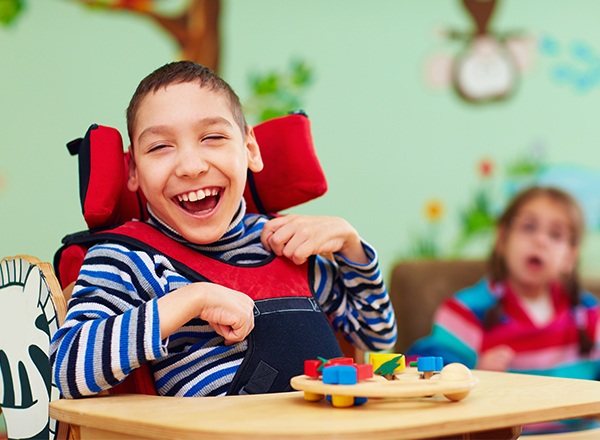 Laughing boy in wheelchair