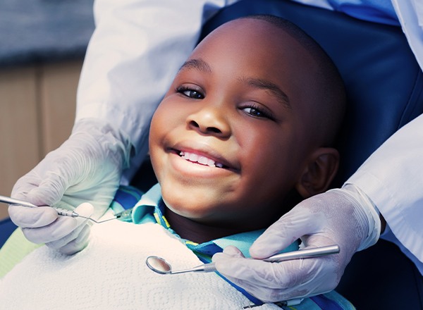 Smiling young boy in dental chair