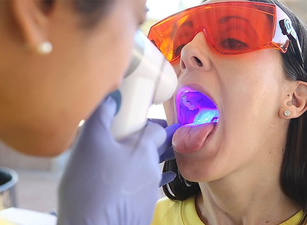 Patient receiving oral cancer screening