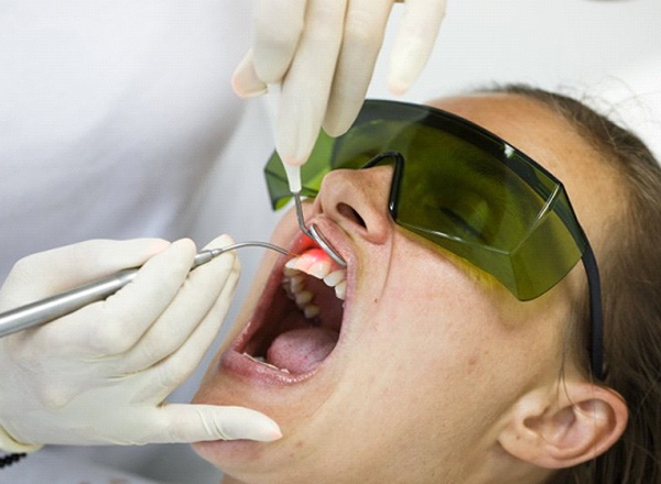 A patient receiving laser dentistry.