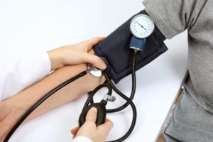Doctor Checking Blood Pressure
