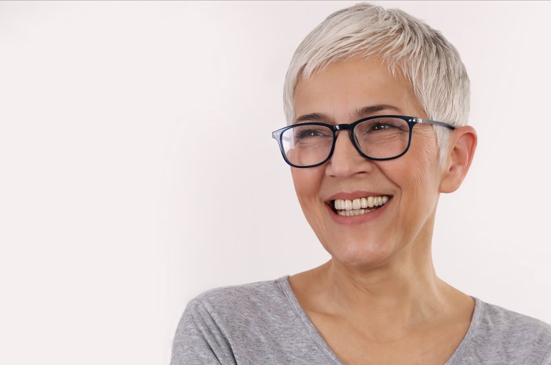 Older Woman with Dental Implants Smiling